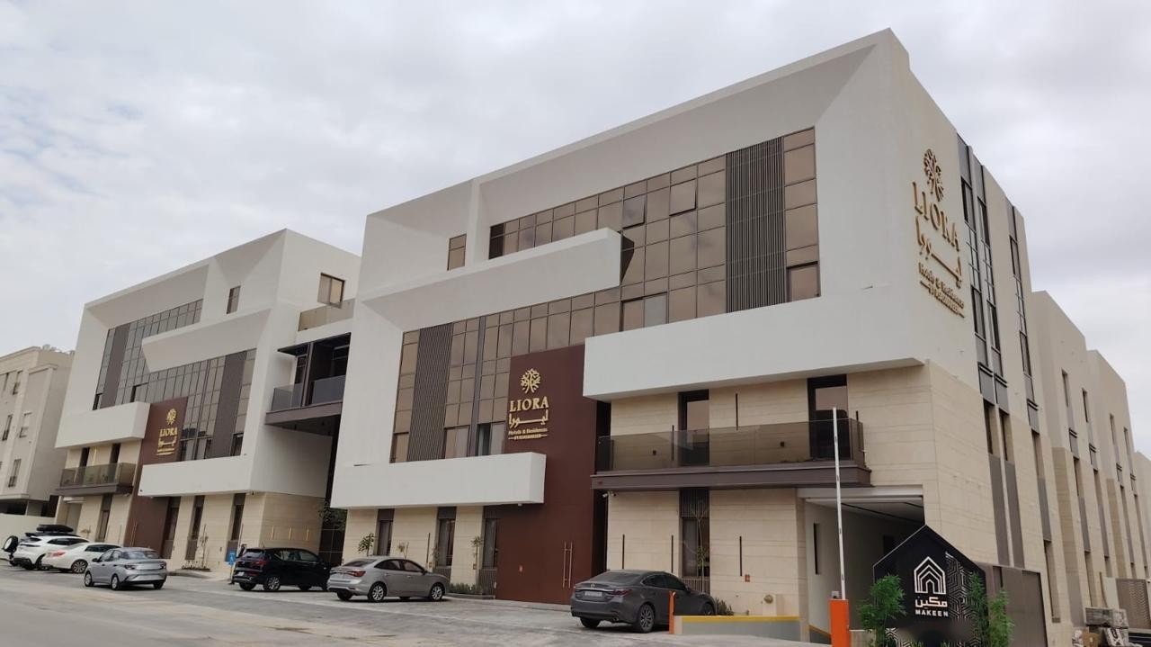 Liora Hotel's cream facades and bronze glazing in daylight